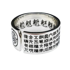 Close-up of the titanium steel ring engraved with intricate Daoist Golden Light Mantra script, radiating spiritual energy.