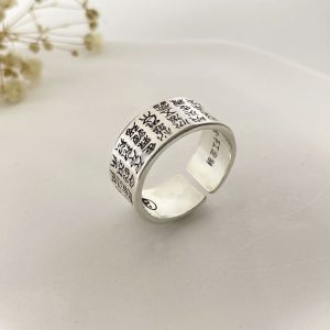 Couple wearing matching mantra rings, representing harmony and shared spiritual growth.