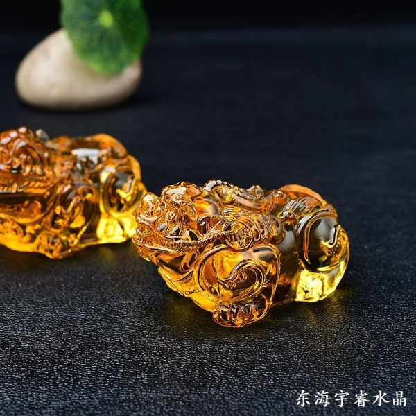 Elegant citrine Feng Shui decor placed on a desk, enhancing career luck and positive energy flow.