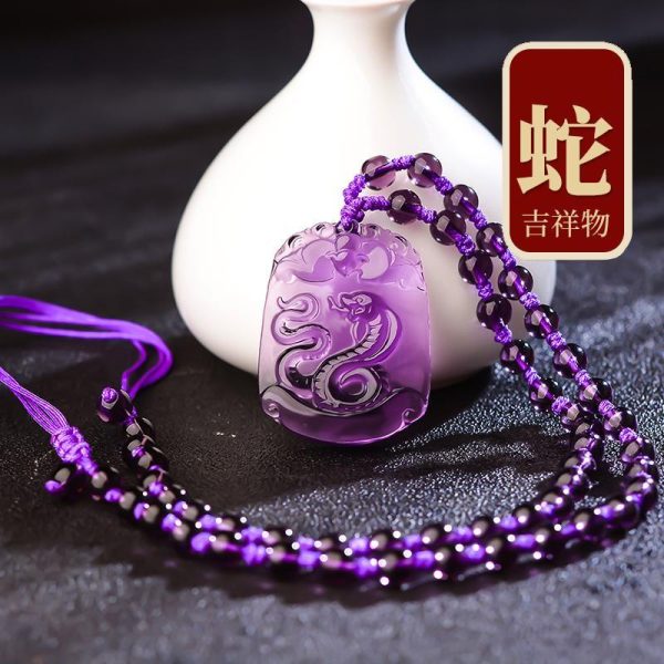 Elegant purple amethyst zodiac pendant engraved with intricate Chinese animal symbols for fortune and protection.