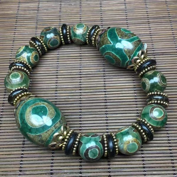 Handcrafted authentic Nine-Eyes Dzi bracelet, a powerful Feng Shui talisman.