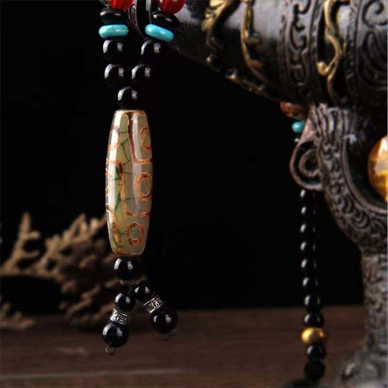 Jet Li-inspired Dzi bead pendant, a symbol of celestial blessings and spiritual armor.