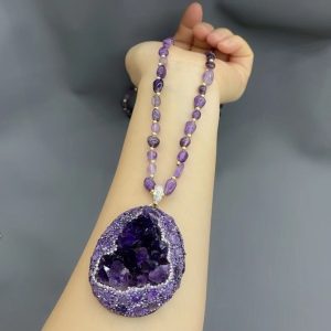 Natural amethyst pendant necklace radiating spiritual energy and elegance.