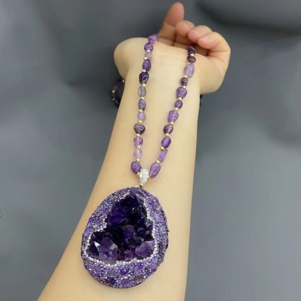 Natural amethyst pendant necklace radiating spiritual energy and elegance.
