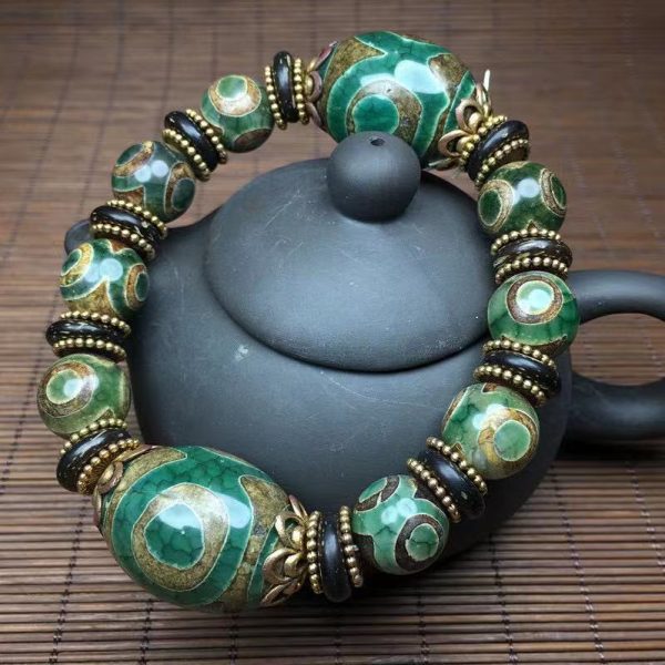 Tibetan Dzi bead bracelet for attracting luck, success, and spiritual harmony.