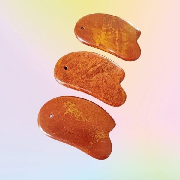 Ergonomic Feng Shui Gua Sha scraping away stagnation to attract wealth.