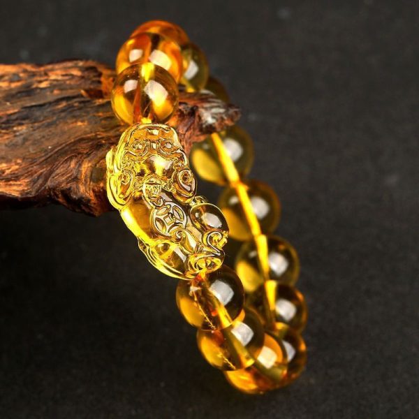 Close-up of intricately carved Pi Yao charm, a powerful Feng Shui guardian for fortune protection