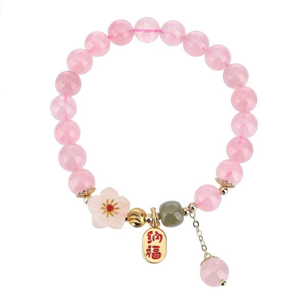 Delicate pink Rose Quartz beads with a Peach Blossom charm, radiating love-attracting energy