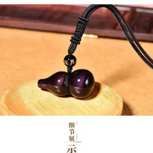 Close-up of the intricately carved gourd (Hulu) charm, a traditional symbol of longevity and fortune in Chinese culture